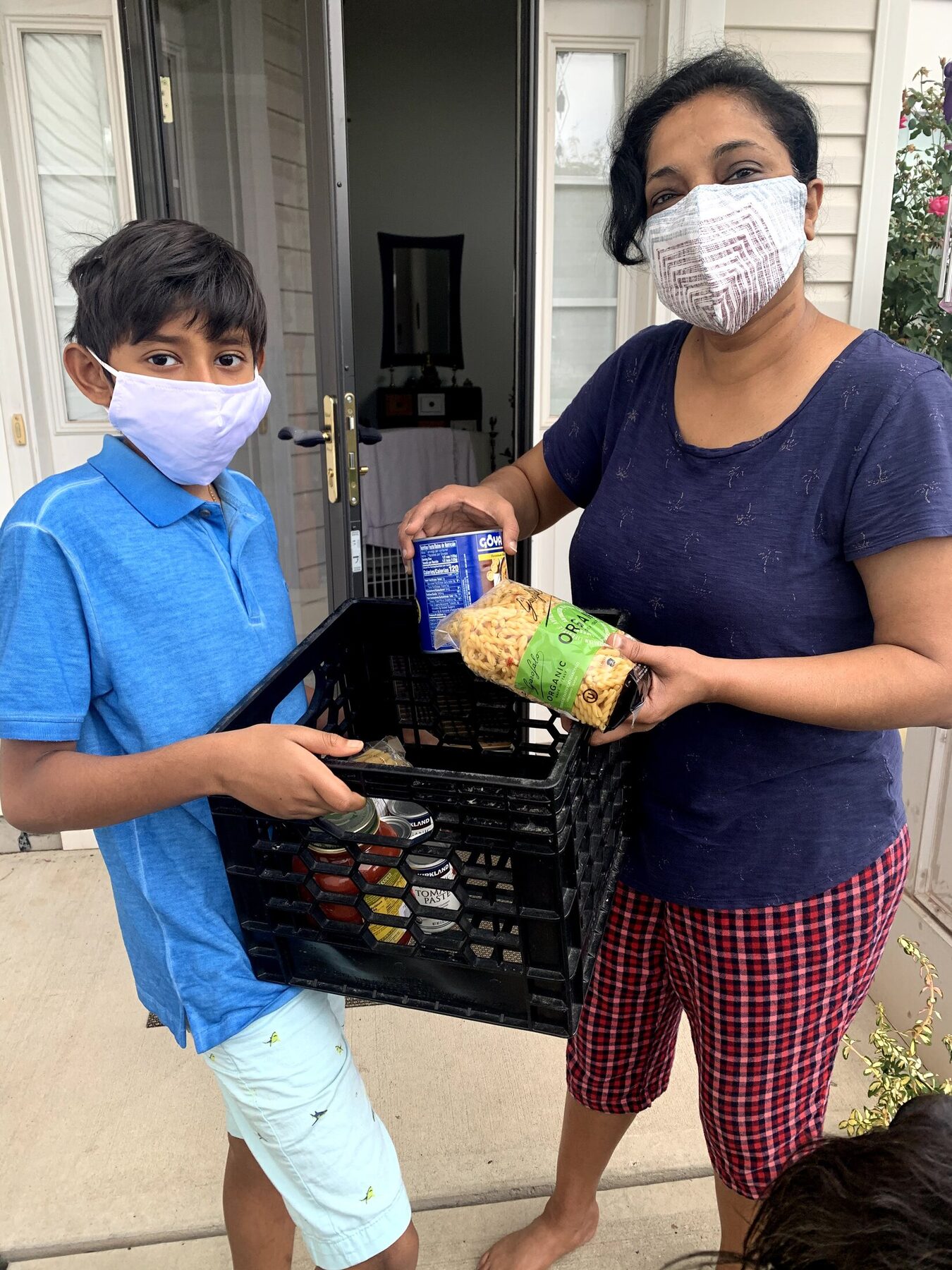 A youth volunteer helping deliver food supplies
