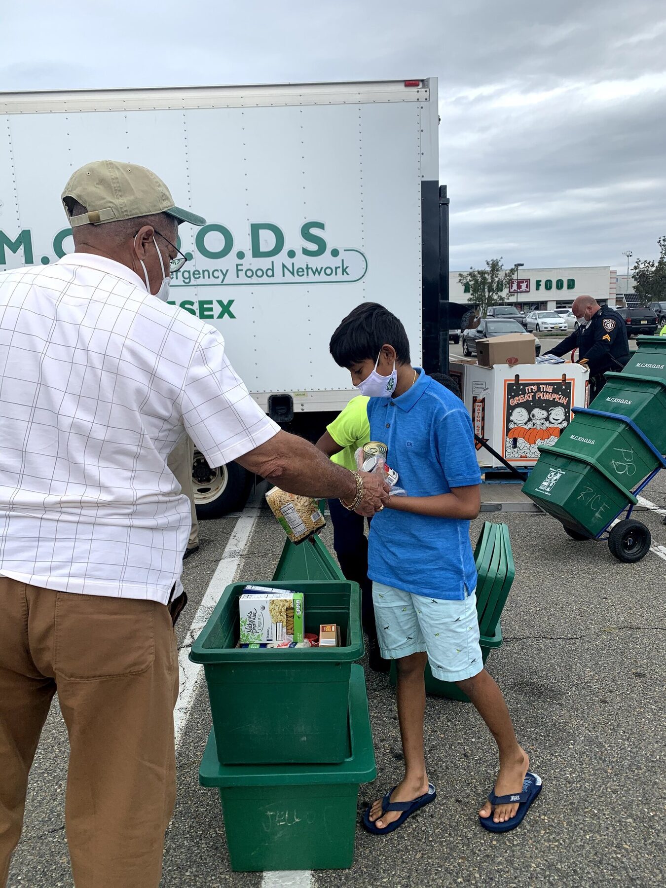 Helping load community food boxes