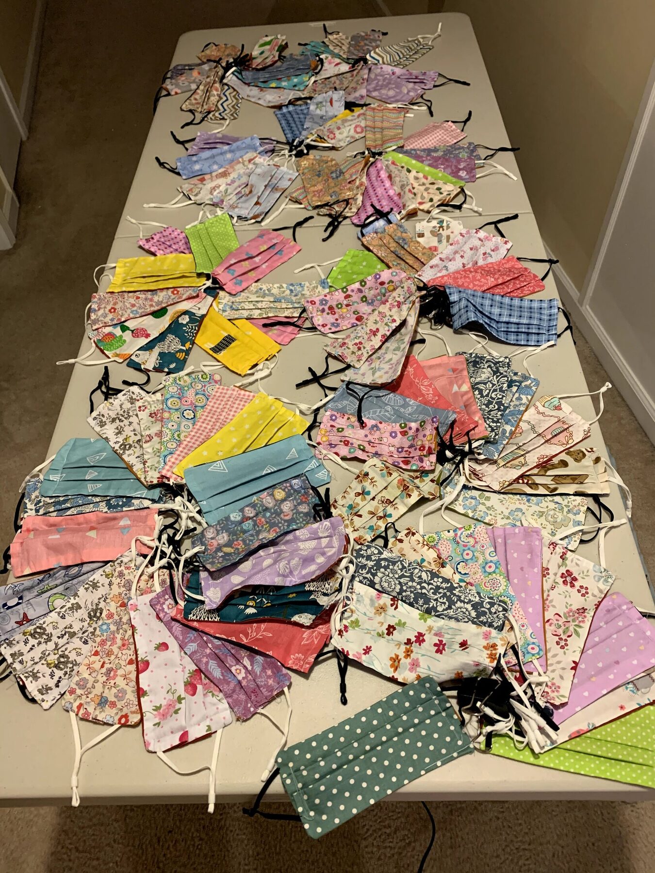 A large assortment of reusable masks ready for distribution