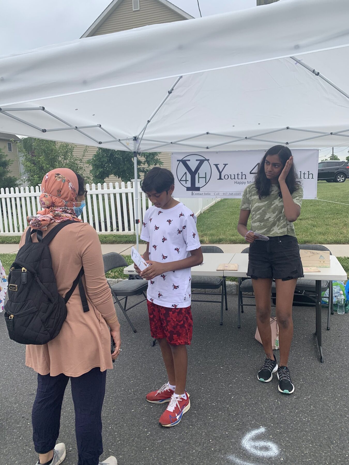 Speaking with visitors at the Youth 4 Health NJ street-fair booth