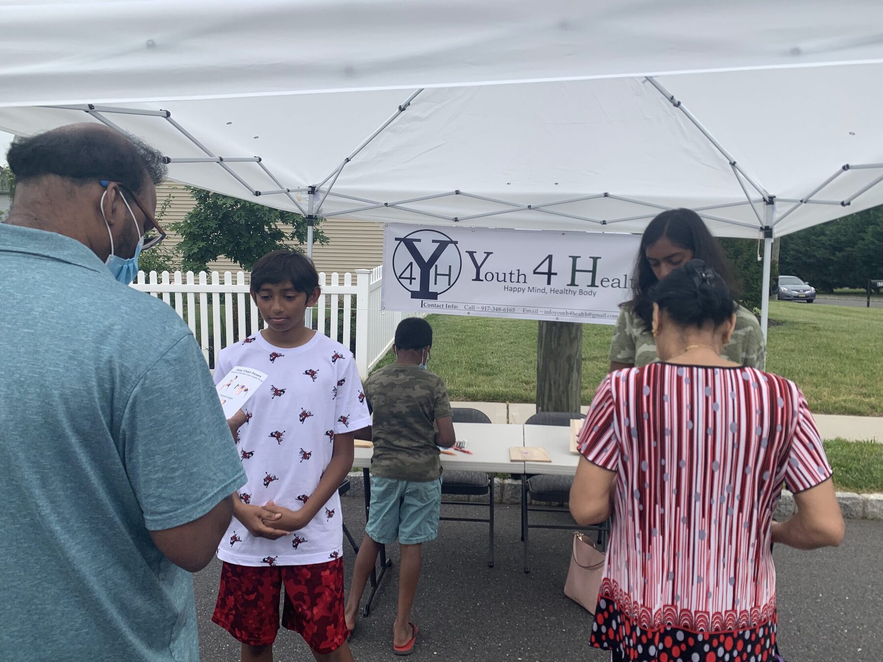 Sharing the project with community members at the outdoor booth