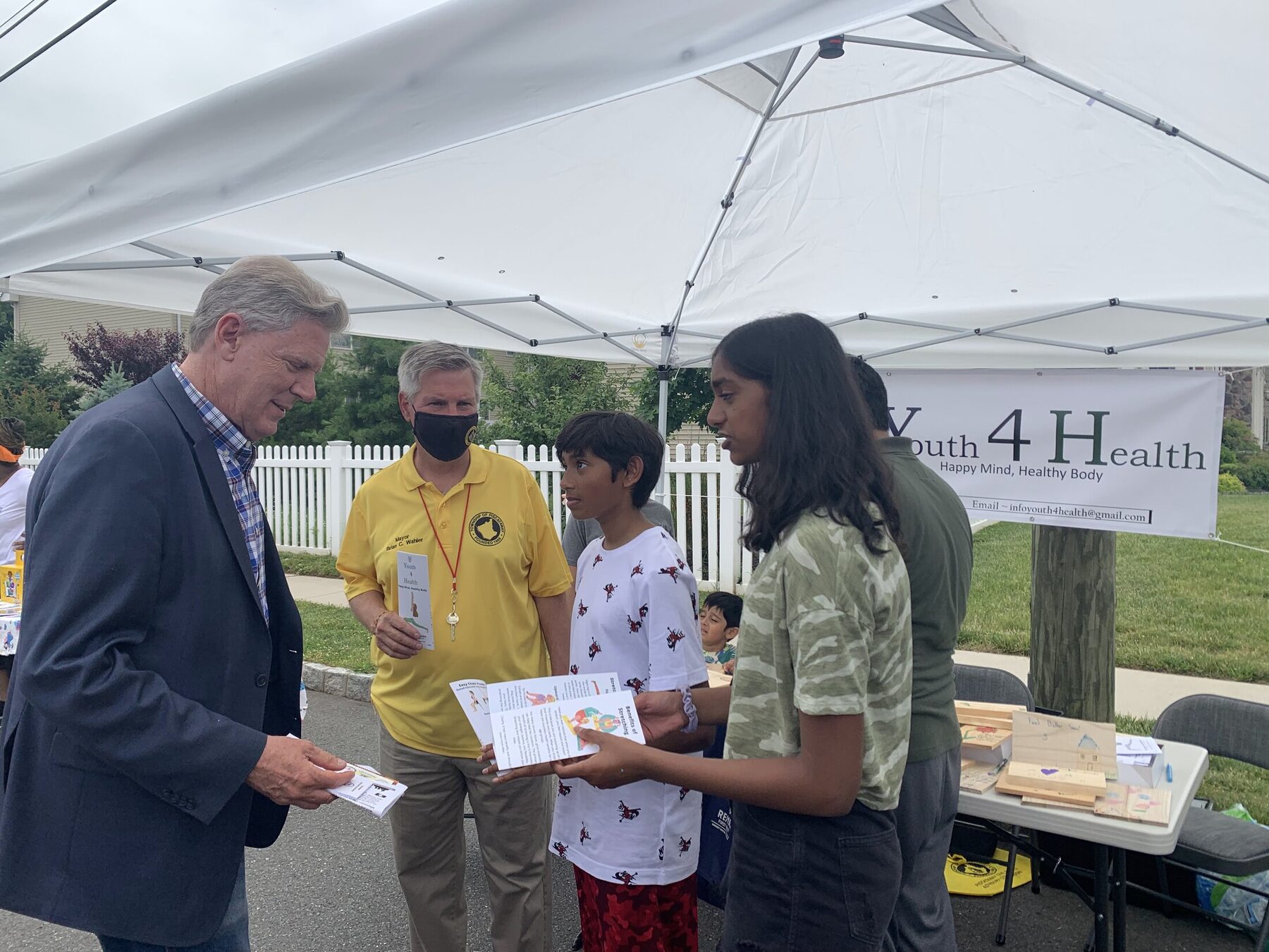 Presenting decorated boards with local community leaders