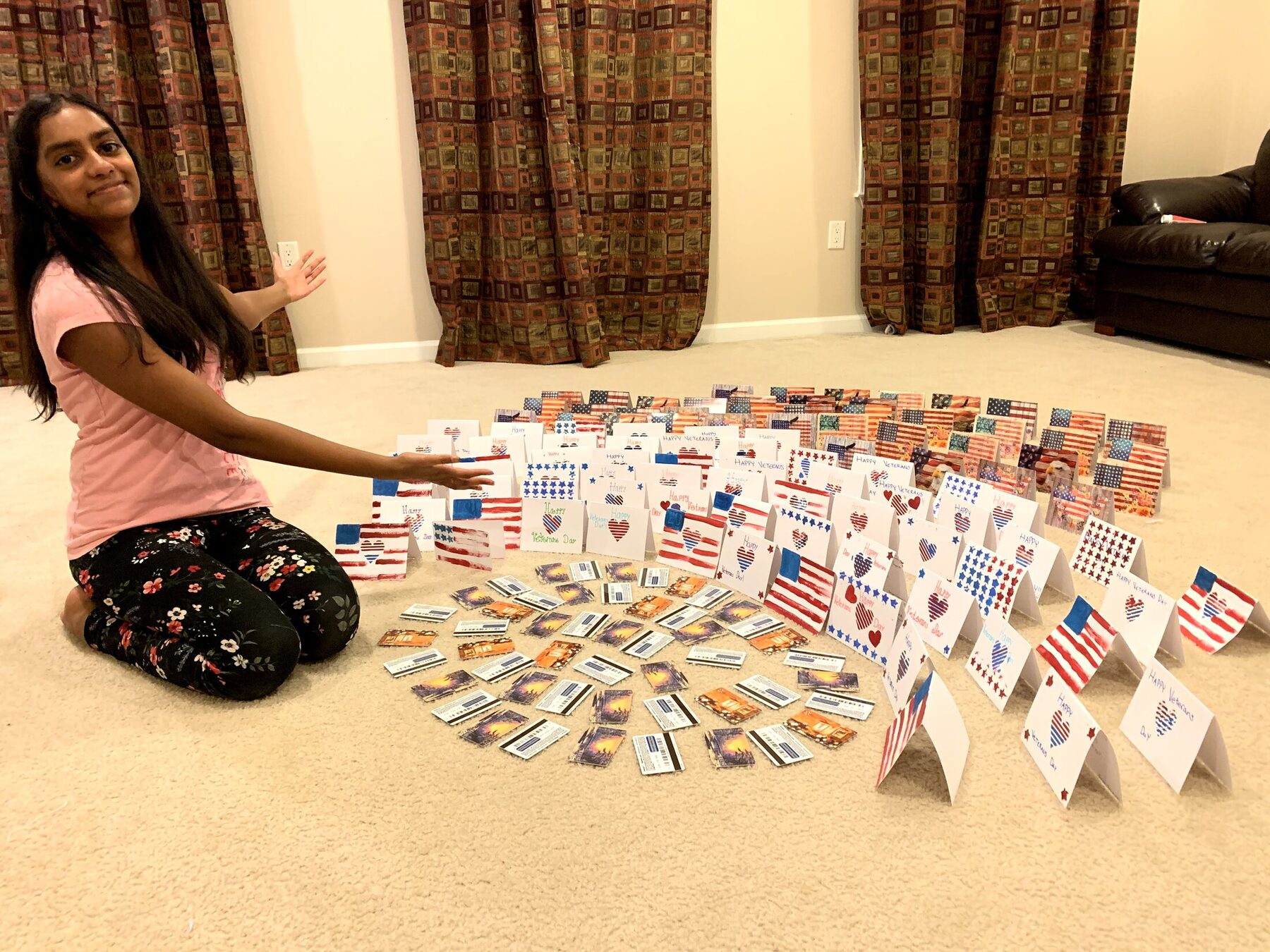 Saanvi with the completed handmade card collection