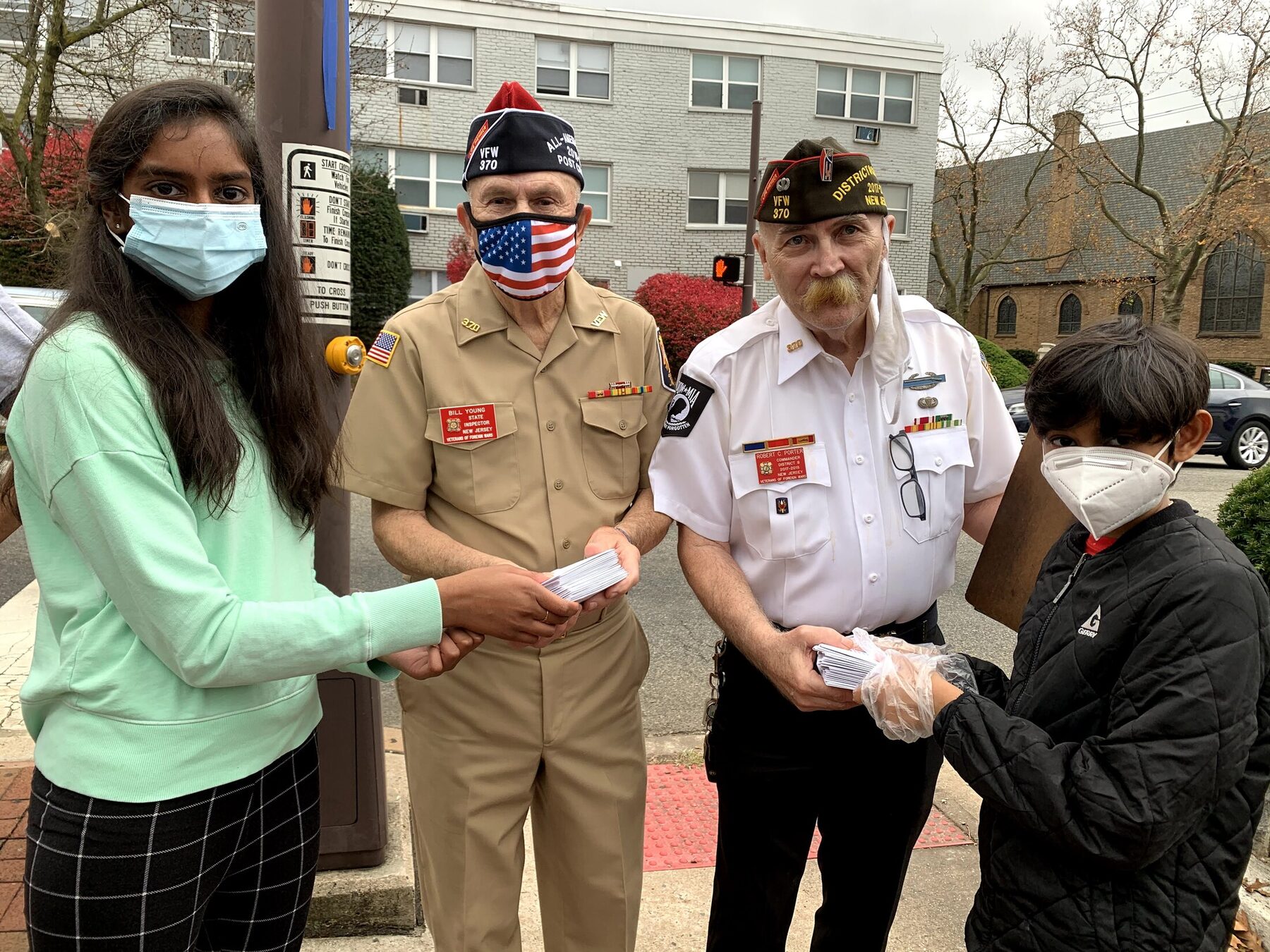 Presenting the finished cards to veterans and community representatives